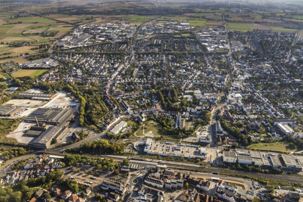 Aerial view, view of Lippstadt south, main railway station, Konrad-Adenauer-Ring, Catholic Church St. Joseph, Lippstadt, Soest district, North Rhine-Westphalia, Germany, place of worship, railway tracks, railway station, Cineplex Lippstadt, City, DE, Deutsche Bahn AG, Europe, religious community, place of worship, main station, holy place, city centre, cinema, church, parish, denomination, Kreis-Soest-Buch, KreisSoestBuch, aerial view, aerial photography, aerial photography, MediaMarkt, local view, religion, religious site, townscape, city area, city centre, overview, bird's-eye view, birds-eyes view, overview