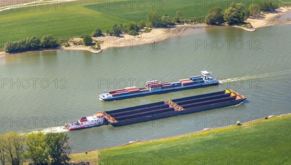 Aerial view, cargo ships on the Rhine, river Rhine, Rees, Lower Rhine, North Rhine-Westphalia, Germany, container ships, DE, Europe, green trees, aerial view, aerial photography, aerial photography, overview, riverbank area, bird's eye view, birds-eyes view, overview
