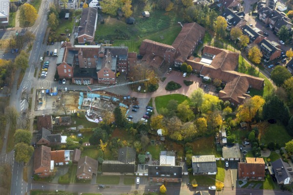 Aerial view, construction site at the Caritas retirement home and care facility Marienheim, Schermbeck, Ruhr area, North Rhine-Westphalia, Germany, retirement home, old people's home, construction work, building, construction area, building site, building plots, building crane, construction project, construction site, care and nursing, DE, Erler Straße, Europe, aerial view, aerial photography, aerial photography, new building, care facility, retirement home, retirement residence, retirement home, retirement centre, overview, bird's-eye view, overview