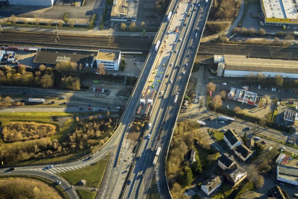 Aerial view, motorway A1, motorway bridge over the Talstraße, motorway junction Wuppertal-Langerfeld, city limits Wuppertal, Schwelm, Ruhr area, North Rhine-Westphalia, Germany, motorway A1 over the federal road B7 Talstraße, motorway bridge, railway tracks, railway line, railway tracks, bridge, federal road B7, DE, Europe, commercial area, commercial area, commercial use, industrial area, industrial site, aerial view, aerial photography, aerial photography, overview, bird's eye view, birds-eyes view, overview