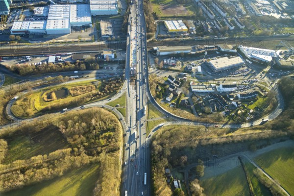 Aerial view, motorway A1, motorway bridge over the Talstraße, motorway junction Wuppertal-Langerfeld, city limits Wuppertal, Schwelm, Ruhr area, North Rhine-Westphalia, Germany, motorway A1 over the federal road B7 Talstraße, motorway bridge, railway tracks, railway line, railway tracks, bridge, federal road B7, DE, Europe, football pitch, commercial area, commercial area, commercial use, industrial area, industrial site, aerial view, aerial photography, aerial photography, overview, bird's-eye view, birds-eyes view, overview