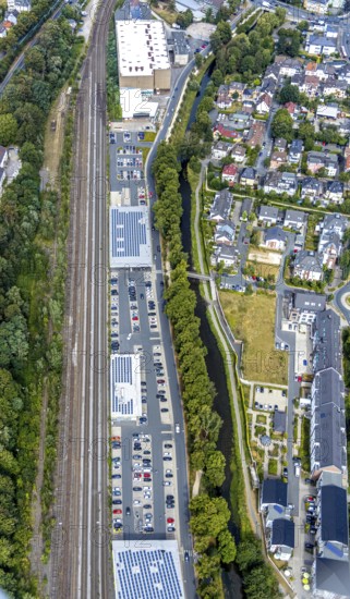 Aerial view, shopping centre Untere Promenade, Hönneinsel, Menden, Sauerland, Märkischer Kreis, North Rhine-Westphalia, Germany, Aldi supermarket, Bringhof Menden Recyclinghof, DE, shopping markets, shopping place, shopping centre, Europe, green trees, island, aerial view, aerial photography, aerial photography, local supply centre, overview, bird's-eye view, birds-eyes view, dm-drogerie markt, overview