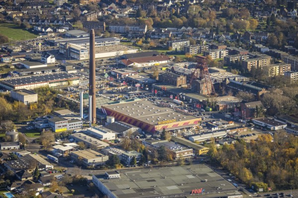 Aerial view, industrial area Rheinpreußenpark, former colliery Rheinpreußen, Moers-Hochstraß, Mörs, Ruhr area, North Rhine-Westphalia, Germany, DE, Europe, winding tower, commercial enterprises, commercial area, commercial park, commercial location, commercial use, Hornbach Baumarkt, industrial area, industrial building, industrial location, aerial photograph, aerial photography, aerial photography, tower, overview, bird's eye view, Zechenstraße, birds-eyes view, historical place, overview