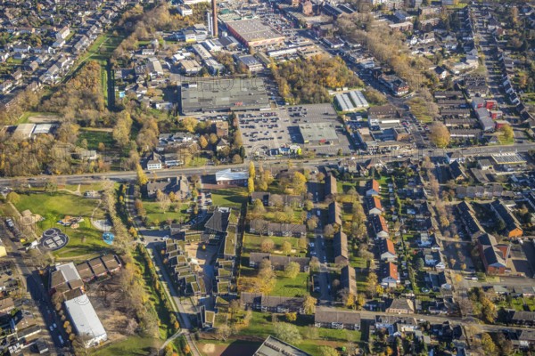 Aerial view, Christus Gemeinde Mörs, AWO Jugendzentrum Kaktus, Justus-von-Liebig-Hauptschule, real shopping centre, Moers-Hochstraß, Mörs, Ruhr area, North Rhine-Westphalia, Germany, place of worship, education, educational institution, DE, shopping markets, shopping square, shopping centre, Europe, religious community, place of worship, main school, holy site, youth centre, church, parish, denomination, educational institute, aerial view, aerial photography, aerial photography, local supply centre, religion, religious site, Römerstraße, school, shopping centre, supermarket, overview, bird's-eye view, birds-eyes view, overview