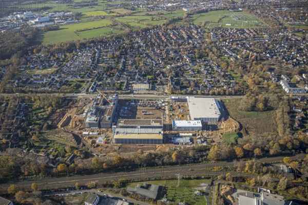 Aerial view, construction site, new Edeka headquarters, Rheinberger Straße, Rheinkamp-Utfort, Mörs, Ruhr area, North Rhine-Westphalia, Germany, construction work, construction, construction area, building site, building plots, construction project, construction site, DE, Edeka Markt, Europe, aerial view, aerial photography, aerial photography, new building, overview, administration, bird's eye view, birds-eyes view, overview