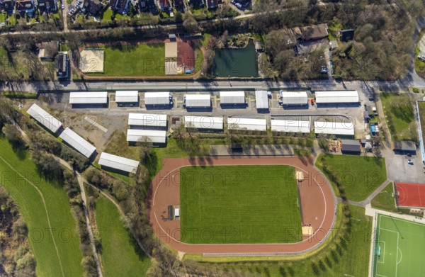 Aerial view, refugee accommodation, sports field Turnerschaft 1912 Mülheim-Saarn, football pitches, Kahlenberger Hockey und Tennisclub, Mülheim an der Ruhr, Ruhr area, North Rhine-Westphalia, Germany, Mülheim, an, der, Ruhr, DE, Europe, birds-eyes, view, aerial photography, aerial photography, aerial photography, overview, overview, bird's-eye view, hobby, sport, training, team, championship, clay court, tennis, tennis playing, tennis club, grass court, artificial grass court, football, football match, football pitch, leisure, athlete, sports field, sports facility, gymnastics, ball sports, fitness, exercise, athletics, refugees, humanity