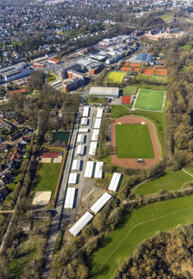 Aerial view, refugee accommodation, sports field Turnerschaft 1912 Mülheim-Saarn, football pitches, Kahlenberger Hockey und Tennisclub, Mülheim an der Ruhr, Ruhr area, North Rhine-Westphalia, Germany, Mülheim, an, der, Ruhr, DE, Europe, birds-eyes, view, aerial photography, aerial photography, aerial photography, overview, overview, bird's-eye view, hobby, sport, training, team, championship, clay court, tennis, tennis playing, tennis club, grass court, artificial grass court, football, football match, football pitch, leisure, athlete, sports field, sports facility, gymnastics, ball sports, fitness, exercise, athletics, refugees, humanity