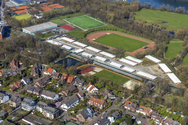 Aerial view, refugee accommodation, sports field Turnerschaft 1912 Mülheim-Saarn, football pitches, Kahlenberger Hockey und Tennisclub, Mülheim an der Ruhr, Ruhr area, North Rhine-Westphalia, Germany, Mülheim, an, der, Ruhr, DE, Europe, birds-eyes, view, aerial photography, aerial photography, aerial photography, overview, overview, bird's-eye view, hobby, sport, training, team, championship, clay court, tennis, tennis playing, tennis club, grass court, artificial grass court, football, football match, football pitch, leisure, athlete, sports field, sports facility, gymnastics, ball sports, fitness, exercise, athletics, refugees, humanity