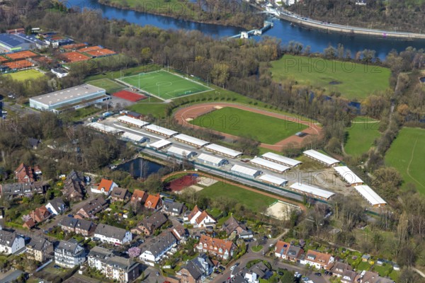 Aerial view, refugee accommodation, sports field Turnerschaft 1912 Mülheim-Saarn, football pitches, Kahlenberger Hockey und Tennisclub, Mülheim an der Ruhr, Ruhr area, North Rhine-Westphalia, Germany, Mülheim, an, der, Ruhr, DE, Europe, birds-eyes, view, aerial photography, aerial photography, aerial photography, overview, overview, bird's-eye view, hobby, sport, training, team, championship, clay court, tennis, tennis playing, tennis club, grass court, artificial grass court, football, football match, football pitch, leisure, athlete, sports field, sports facility, gymnastics, ball sports, fitness, exercise, athletics, refugees, humanity