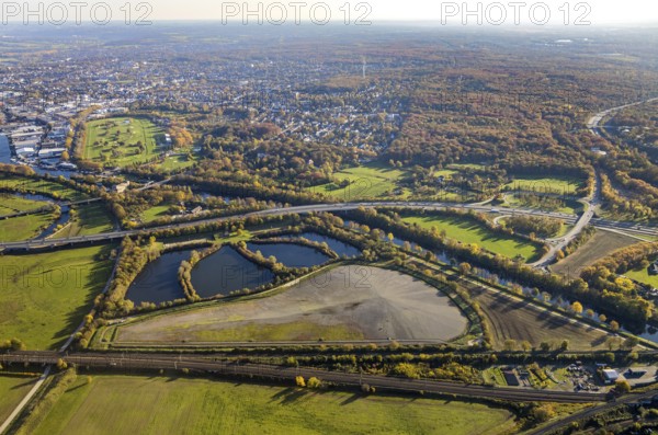 Aerial view, sewage sludge landfill at Ruhrbogen Ruhrschifffahrtskanal, Schleuseninsel, Styrumer Ruhrauen, city triangle DU - OB - MH, Speldorf - Nordwest, Mülheim an der Ruhr, Ruhr area, North Rhine-Westphalia, Germany, motorway A40, railway tracks, DE, railway bridge, Europe, distant view, aerial view, aerial photography, aerial photography, overview, bird's-eye view, overview