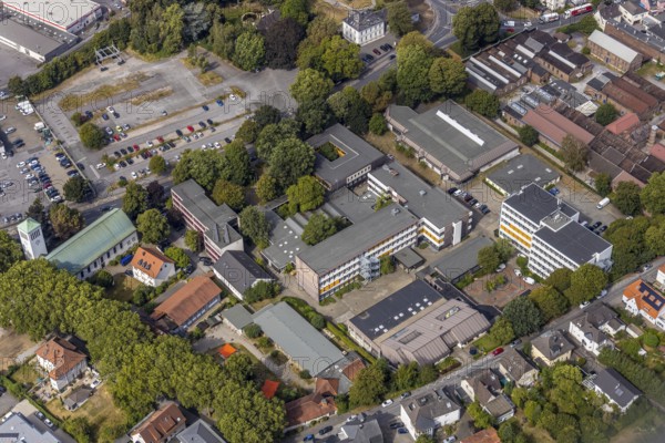 Aerial view, Hönne Berufskolleg, Kreissporthalle Menden, Kath. Kirche St. Walburgis, Kissing GmbH, Menden, Sauerland, Märkischer Kreis, North Rhine-Westphalia, Germany, place of worship, vocational school, education, educational institution, DE, Europe, commercial area, religious community, place of worship, church, parish, denomination, educational institute, aerial photography, aerial photography, aerial photography, producer and developer of high-quality devotional objects, symbols of faith and host baking utensils, religion, school, sports, sports hall, overview, bird's-eye view, Werler Straße, birds-eyes view, overview