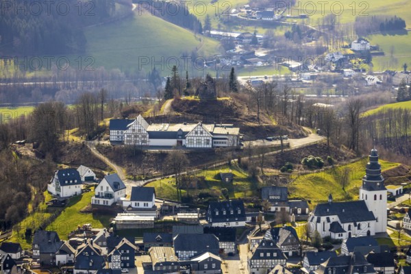 Aerial view, Eversberg Castle ruins, Schlossberghalle Eversberg, St.Johannes-Evangelist-Kirche, Eversberg, Meschede, Sauerland, North Rhine-Westphalia, Germany, castle, DE, Europe, half-timbered houses, religious community, place of worship, property tax, real estate, church, parish, denomination, aerial view, aerial photography, aerial photography, Arnsberg Forest nature park Park, religion, ruins, castle, castle hill, overview, event location, event venue, bird's-eye view, meadows and fields, residential area, housing and living, residential area, residential buildings, residential quality, residential neighbourhood, housing estate, bird's-eye view, cultural use, overview