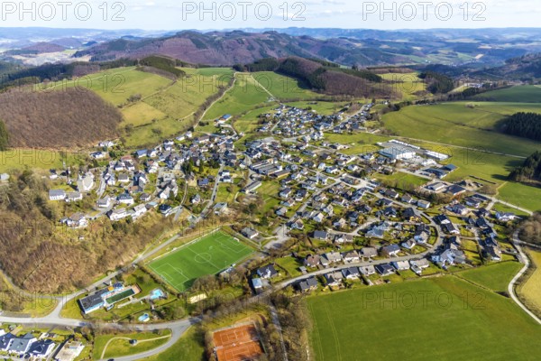 Aerial view, local view Grevenstein, sports field and tennis courts, Grevenstein, Meschede, Sauerland, North Rhine-Westphalia, Germany, An der Streue, brewery, DE, Europe, football pitch, football stadium, beverage producer, property tax, hilly landscape, real estate, aerial view, aerial photography, aerial photography, sports, sports facilities, sports field, sports facility, stadium, tennis, tennis facility, tennis courts, overview, Veltins, bird's-eye view, forest area, meadows and fields, residential area, living and living, residential area, residential buildings, quality of living, birds-eyes view, overview