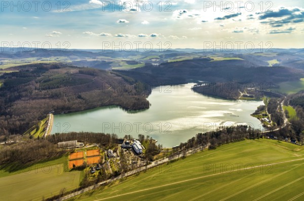 Aerial view, Hennetalsperre, Hennesee, Welcome Hotel Meschede Hennesee, Meschede, Sauerland, North Rhine-Westphalia, Germany, DE, food and drink, Europe, distant view, shapes and colours, inn, gastronomy, Hennedamm, hotel, hotel facilities, hotel industry, hilly landscape, landscape panorama, aerial view, aerial photography, aerial photography, mixed forest, coniferous forest, sport, dam wall, reservoir, dam, tennis, tennis facility, tennis courts, overview, bird's-eye view, forest, forest area, forest dieback, Welcome Hotel Meschede/Hennesee, birds-eyes view, overview