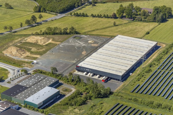 Aerial view, industrial estate Enste Nord, new building logistics centre Briloner Leuchten GmbH, Meschede, Sauerland, North Rhine-Westphalia, Germany, motorway A46, motorway junction Enste, DE, Europe, commercial enterprises, commercial area, industrial estate, commercial park, commercial location, commercial use, Hochsauerlandkreis, industrial area, industrial location, aerial view, aerial photography, aerial photography, solar park Enste, overview, bird's-eye view, overview
