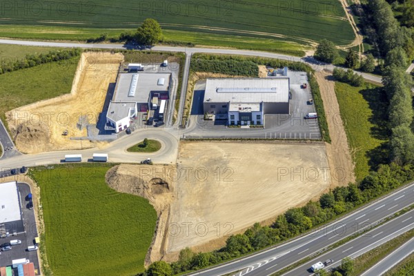 Aerial view, industrial park Enste Nord, Meschede, Sauerland, North Rhine-Westphalia, Germany, motorway A46, motorway junction Enste, DE, Europe, commercial enterprises, commercial area, commercial park, commercial location, commercial use, Hochsauerlandkreis, industrial area, industrial location, aerial view, aerial photography, aerial photography, photovoltaics, photovoltaic system, solar, solar system, solar energy, solar park Enste, overview, bird's-eye view, birds-eyes view, overview