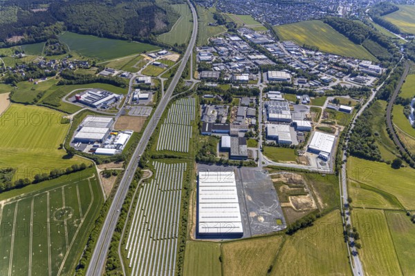 Aerial view, industrial estate Enste Nord, new building logistics centre Briloner Leuchten GmbH, Meschede, Sauerland, North Rhine-Westphalia, Germany, motorway A46, motorway junction Enste, DE, Europe, commercial enterprises, commercial area, industrial estate, commercial park, commercial location, commercial use, Hochsauerlandkreis, industrial area, industrial location, aerial view, aerial photography, aerial photography, solar park Enste, overview, bird's-eye view, overview