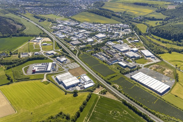 Aerial view, industrial estate Enste Nord, new building logistics centre Briloner Leuchten GmbH, Meschede, Sauerland, North Rhine-Westphalia, Germany, motorway A46, motorway junction Enste, DE, Europe, commercial enterprises, commercial area, industrial estate, commercial park, commercial location, commercial use, Hochsauerlandkreis, industrial area, industrial location, aerial view, aerial photography, aerial photography, solar park Enste, overview, bird's-eye view, overview