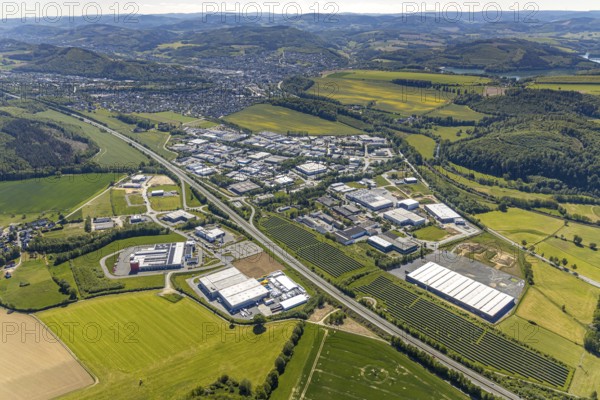 Aerial view, industrial estate Enste Nord, new building logistics centre Briloner Leuchten GmbH, Meschede, Sauerland, North Rhine-Westphalia, Germany, motorway A46, motorway junction Enste, DE, Europe, commercial enterprises, commercial area, industrial estate, commercial park, commercial location, commercial use, Hochsauerlandkreis, industrial area, industrial location, aerial view, aerial photography, aerial photography, solar park Enste, overview, bird's-eye view, overview