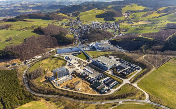 Aerial view, View of Grevenstein, Brewery C.& A. VELTINS GmbH & Co. KG, new high-bay warehouse, Grevenstein, Meschede, Sauerland, North Rhine-Westphalia, Germany, An der Streue, construction work, construction site, construction crane, construction measure, construction project, construction site, brewery, DE, Europe, beverage manufacturer, property tax, hilly landscape, real estate, capacity requirement, aerial view, aerial photography, aerial photography, new building, overview, Veltins, bird's-eye view, forest area, meadows and fields, housing estate, living and living, residential area, residential buildings, quality of living, birds-eyes view, overview