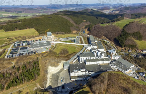 Aerial view, Brewery C.& A. VELTINS GmbH & Co. KG, new high-bay warehouse, Grevenstein, Meschede, Sauerland, North Rhine-Westphalia, Germany, An der Streue, construction work, construction site, construction crane, construction measure, construction project, construction site, brewery, DE, Europe, beverage manufacturer, hilly landscape, capacity requirement, aerial view, aerial photography, aerial photography, new building, overview, Veltins, bird's eye view, forest area, meadows and fields, bird's eye view, overview
