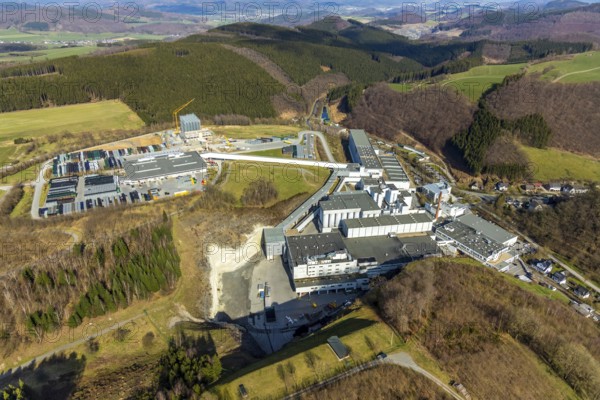 Aerial view, Brewery C.& A. VELTINS GmbH & Co. KG, new high-bay warehouse, Grevenstein, Meschede, Sauerland, North Rhine-Westphalia, Germany, An der Streue, construction work, construction site, construction crane, construction measure, construction project, construction site, brewery, DE, Europe, beverage manufacturer, hilly landscape, capacity requirement, aerial view, aerial photography, aerial photography, new building, overview, Veltins, bird's eye view, forest area, meadows and fields, bird's eye view, overview