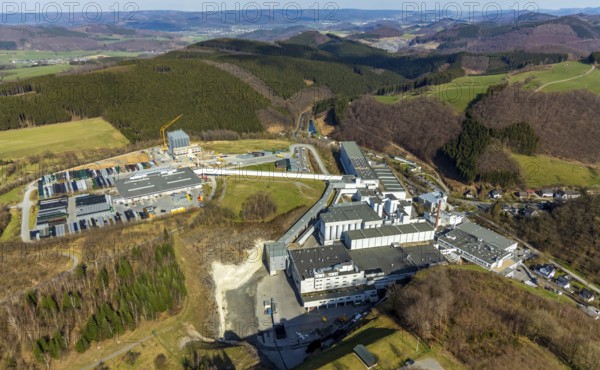 Aerial view, Brewery C.& A. VELTINS GmbH & Co. KG, new high-bay warehouse, Grevenstein, Meschede, Sauerland, North Rhine-Westphalia, Germany, An der Streue, construction work, construction site, construction crane, construction measure, construction project, construction site, brewery, DE, Europe, beverage manufacturer, hilly landscape, capacity requirement, aerial view, aerial photography, aerial photography, new building, overview, Veltins, bird's eye view, forest area, meadows and fields, bird's eye view, overview
