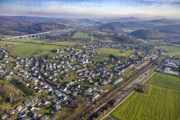 Aerial view, local view Wennemen, bridge motorway A46, Meschede, Sauerland, North Rhine-Westphalia, Germany, motorway A46, motorway bridge, railway tracks, mountains and valleys, DE, single-family houses, Europe, distant view, property tax, hilly landscape, real estate, aerial view, aerial photography, aerial photography, mixed forest, overview, bird's eye view, forest, forest area, forest dieback, living and life, residential buildings, housing estate, birds-eyes view, overview