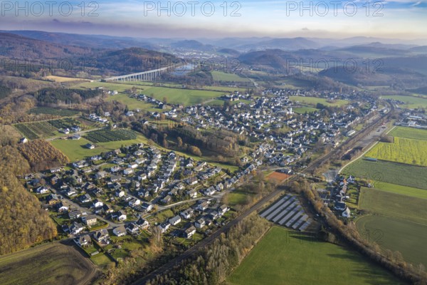 Aerial view, local view Wennemen, bridge motorway A46, Meschede, Sauerland, North Rhine-Westphalia, Germany, motorway A46, motorway bridge, railway tracks, mountains and valleys, DE, single-family houses, Europe, distant view, property tax, hilly landscape, real estate, aerial view, aerial photography, aerial photography, mixed forest, overview, bird's eye view, forest, forest area, forest dieback, living and life, residential buildings, housing estate, birds-eyes view, overview