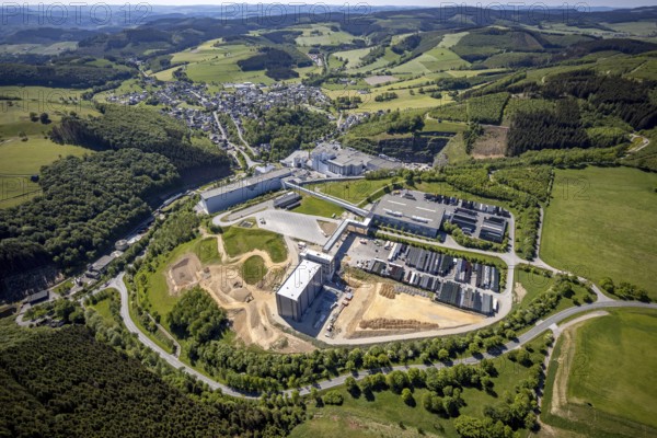 Aerial view, Brewery C.& A. VELTINS GmbH & Co. KG, new construction high-bay warehouse, Grevenstein, Meschede, Sauerland, North Rhine-Westphalia, Germany, An der Streue, construction work, construction site, construction crane, construction measure, construction project, construction site, brewery, DE, Europe, beverage manufacturer, Hochsauerlandkreis, hilly landscape, capacity requirement, aerial view, aerial photography, aerial photography, new construction, overview, Veltins, bird's-eye view, forest area, meadows and fields, birds-eyes view, overview