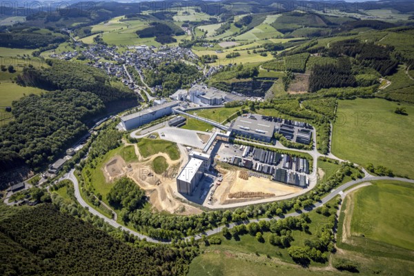 Aerial view, Brewery C.& A. VELTINS GmbH & Co. KG, new construction high-bay warehouse, Grevenstein, Meschede, Sauerland, North Rhine-Westphalia, Germany, An der Streue, construction work, construction site, construction crane, construction measure, construction project, construction site, brewery, DE, Europe, beverage manufacturer, Hochsauerlandkreis, hilly landscape, capacity requirement, aerial view, aerial photography, aerial photography, new construction, overview, Veltins, bird's-eye view, forest area, meadows and fields, birds-eyes view, overview
