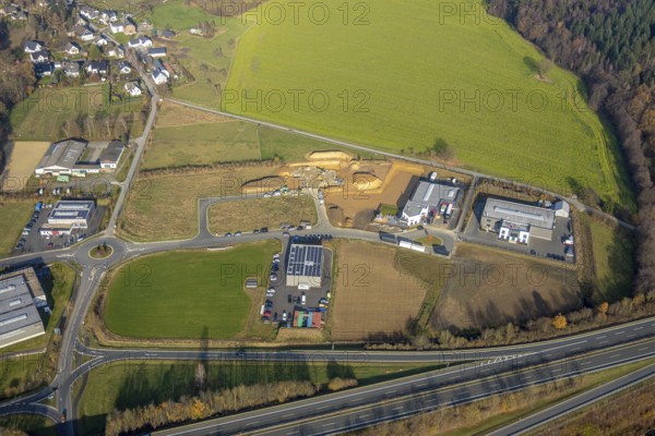 Aerial view, construction site industrial estate Enste, Auto Technik Schulte, Auf dem Bruch, Enste, Meschede, Sauerland, North Rhine-Westphalia, Germany, expansion areas, motorway A46, motorway exit Enste, construction area, building site, building plots, construction project, construction site, construction site industrial estate Auf dem Bruch, DE, development, Europe, commercial enterprises, commercial area, industrial estate, commercial park, commercial location, commercial use, industrial area, industrial building, industrial location, Juma Logistik GmbH, capacity requirements, roundabout, roundabout, aerial view, aerial photography, aerial photography, production plants, production halls, overview, bird's-eye view, meadows and fields, birds-eyes view, overview