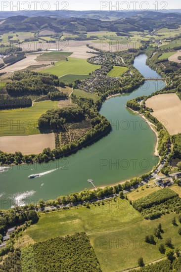 Aerial view, Hennetalsperre, Hennesee, excursion boat, holiday home complex Hennestrand, KNAUS Campingpark Hennesee, Meschede, Sauerland, North Rhine-Westphalia, Germany, DE, Europe, shapes and colours, Hochsauerlandkreis, landscape panorama, aerial view, aerial photography, aerial photography, mixed forest, coniferous forest, passenger shipping Hennesee, dam wall, reservoir, dam, overview, bird's-eye view, forest, forest area, meadows and fields, birds-eyes view, overview