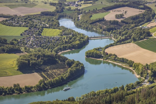 Aerial view, Hennetalsperre, Hennesee, excursion boat, holiday home complex Hennestrand, KNAUS Campingpark Hennesee, Meschede, Sauerland, North Rhine-Westphalia, Germany, DE, Europe, shapes and colours, Hochsauerlandkreis, landscape panorama, aerial view, aerial photography, aerial photography, mixed forest, coniferous forest, passenger shipping Hennesee, dam wall, reservoir, dam, overview, bird's-eye view, forest, forest area, meadows and fields, birds-eyes view, overview