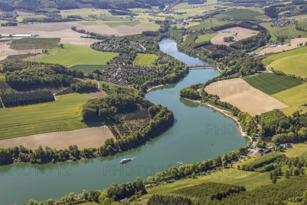 Aerial view, Hennetalsperre, Hennesee, excursion boat, holiday home complex Hennestrand, KNAUS Campingpark Hennesee, Meschede, Sauerland, North Rhine-Westphalia, Germany, DE, Europe, shapes and colours, Hochsauerlandkreis, landscape panorama, aerial view, aerial photography, aerial photography, mixed forest, coniferous forest, passenger shipping Hennesee, dam wall, reservoir, dam, overview, bird's-eye view, forest, forest area, meadows and fields, birds-eyes view, overview