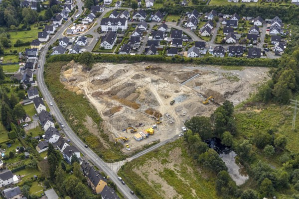 Aerial view, construction site construction area residential development Waldstraße, former concrete plant Alte Ziegelei II, Waldstraße, Meschede, Sauerland, North Rhine-Westphalia, Germany, construction work, construction vehicles, construction area, construction site, building plots, construction project, construction site, DE, development, Europe, property tax, Hochsauerlandkreis, real estate, capacity requirement, aerial view, aerial photography, aerial photography, overview, bird's-eye view, housing estate, living and living, residential area, residential buildings, residential quality, residential neighbourhood, housing estate, birds-eyes view, overview