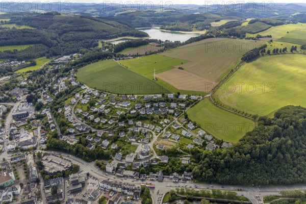 Aerial view, town view, Meschede, planned building area near Langelohweg, Hennesee, Hennetalsperre, Sauerland, Hochsauerlandkreis, North Rhine-Westphalia, Germany, building area, mountains and valleys, city, DE, Europe, radio tower, property tax, hilly landscape, real estate, aerial view, aerial photography, aerial photography, Schröershof holiday home rental, townscape, city area, overview, bird's-eye view, forest area, meadows and fields, residential area, living and life, residential area, quality of life, birds-eyes view, overview