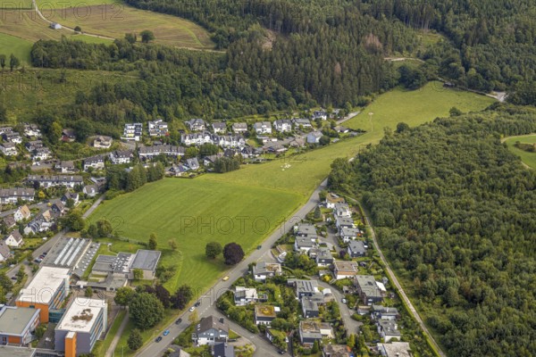 Aerial view, grammar school of the city of Meschede, meadow area Schederweg, planned building area near Menzelweg, Meschede, Sauerland, Hochsauerlandkreis, North Rhine-Westphalia, Germany, building area, building site, building plots, building project, education, educational institution, DE, Europe, property tax, grammar school, real estate, capacity requirements, educational institute, aerial view, aerial photography, aerial photography, Mescheder Höhenwanderweg, Schederweg, school, overview, bird's-eye view, forest area, meadows and fields, housing estate, living and life, residential area, residential buildings, residential quality, residential neighbourhood, housing estate, birds-eyes view, overview