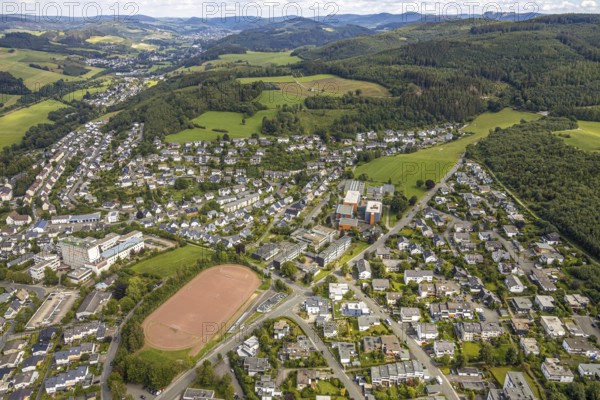 Aerial view, local view Löttmaringhausen, grammar school of the city Meschede, secondary school of the city Meschede, Telekom Meschede, sports field school centre, meadow area Schederweg, planned building area near Menzelweg, Meschede, Sauerland, Hochsauerlandkreis, North Rhine-Westphalia, Germany, mountains and valleys, DE, Europe, football field, property tax, hilly landscape, real estate, aerial view, aerial photography, aerial photography, sports, sports facilities, sports field, sports facility, overview, bird's-eye view, wooded area, meadows and fields, residential area, living and living, residential area, residential buildings, residential quality, residential neighbourhood, housing estate, birds-eyes view, overview