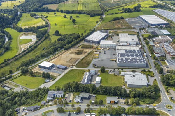 Aerial view, construction site new building Lausberg Kunststofftechnik, industrial estate Meschede-Enste, Am Heerweg, Meschede, Sauerland, Hochsauerlandkreis, North Rhine-Westphalia, Germany, construction work, construction area, building site, building plots, construction project, construction site, Caritas-Werkstätten Meschede, DE, Europe, commercial enterprises, commercial area, commercial park, commercial site, commercial use, industrial area, industrial site, L743 state road, Lausberg, Lausberg Kunststofftechnik, aerial photograph, aerial photography, aerial photography, MÖNIG Spedition, new building, R.A.B.E. waste processing, overview, bird's-eye view, birds-eyes view, overview