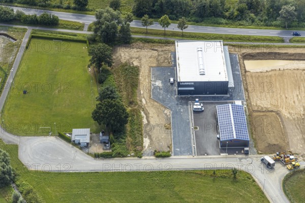 Aerial view, construction site new building Lausberg Kunststofftechnik, industrial estate Meschede-Enste, Am Heerweg, Meschede, Sauerland, Hochsauerlandkreis, North Rhine-Westphalia, Germany, construction work, construction area, building site, building plots, construction project, construction site, Caritas-Werkstätten Meschede, DE, Europe, commercial enterprises, commercial area, commercial park, commercial site, commercial use, industrial area, industrial site, L743 state road, Lausberg, Lausberg Kunststofftechnik, aerial photograph, aerial photography, aerial photography, MÖNIG Spedition, new building, R.A.B.E. waste processing, overview, bird's-eye view, birds-eyes view, overview