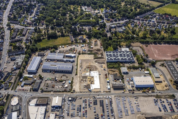 Aerial view, construction site ENNI factory and administration building, former carpenter's workshop Cleve, recycling centre, building with solar roofs, Mörs, Ruhr area, North Rhine-Westphalia, Germany, DE, Europe, birds-eyes, view, aerial photograph, aerial photography, aerial photography, overview, bird's eye view, administration building