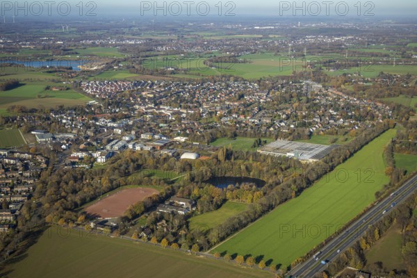 Aerial view, local view Kapellen, leisure park Kapellen, Fritz-Peters sports ground Kapellen, Mörs, Ruhr area, North Rhine-Westphalia, Germany, DE, Europe, distant view, football pitch, football stadium, football club, property tax, real estate, aerial view, aerial photography, aerial photography, lake, sports, sports facilities, sports field, sports facility, stadium, pond, overview, bird's eye view, corrugated box factory Fritz Peters, residential area, living and living, residential area, residential buildings, birds-eyes view, overview