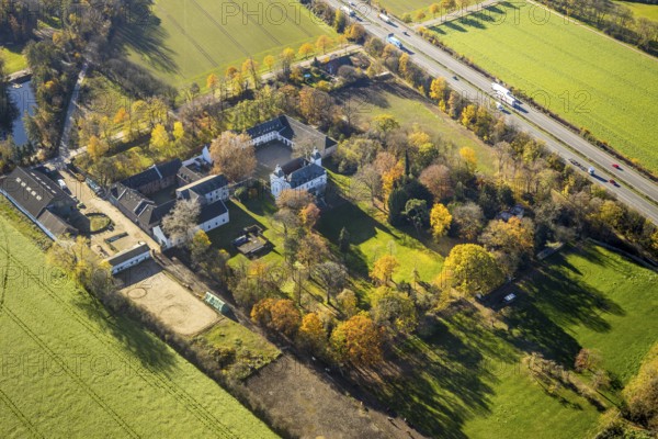 Aerial view, Lauersfort Castle, Kapellen-Holderberg, Mörs, Ruhr area, North Rhine-Westphalia, Germany, DE, monument protection, Europe, moat, autumn colours, manor house, manor building, Lauersforter Straße, aerial view, aerial photography, aerial photography, park, park grounds, castle, castle grounds, castle garden, castle park, overview, bird's-eye view, moated castle, moated moat, moated castle, birds-eyes view, former manor, overview