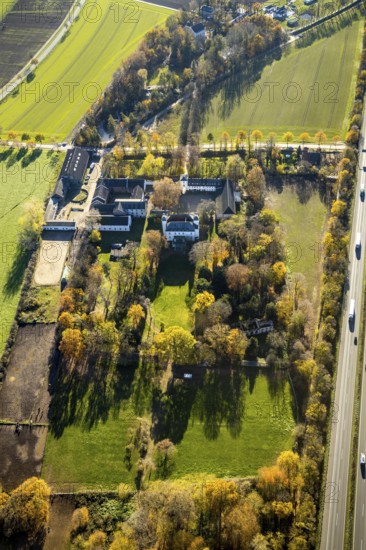 Aerial view, Lauersfort Castle, Kapellen-Holderberg, Mörs, Ruhr area, North Rhine-Westphalia, Germany, DE, monument protection, Europe, moat, autumn colours, manor house, manor building, Lauersforter Straße, aerial view, aerial photography, aerial photography, park, park grounds, castle, castle grounds, castle garden, castle park, overview, bird's-eye view, moated castle, moated moat, moated castle, birds-eyes view, former manor, overview