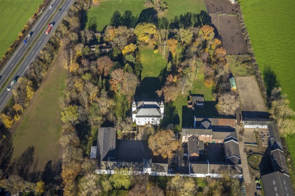 Aerial view, Lauersfort Castle, Kapellen-Holderberg, Mörs, Ruhr area, North Rhine-Westphalia, Germany, DE, monument protection, Europe, moat, autumn colours, manor house, manor building, Lauersforter Straße, aerial view, aerial photography, aerial photography, park, park grounds, castle, castle grounds, castle garden, castle park, overview, bird's eye view, moated castle, moated moat, moated castle, birds-eyes view, former manor, overview