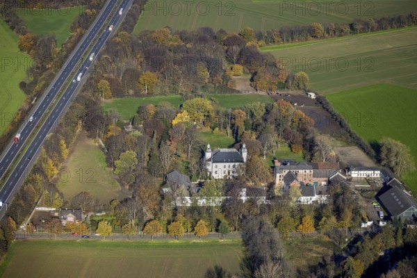 Aerial view, Lauersfort Castle, Kapellen-Holderberg, Mörs, Ruhr area, North Rhine-Westphalia, Germany, DE, monument protection, Europe, moat, autumn colours, manor house, manor building, Lauersforter Straße, aerial view, aerial photography, aerial photography, park, park grounds, castle, castle grounds, castle garden, castle park, overview, bird's eye view, moated castle, moated moat, moated castle, birds-eyes view, former manor, overview