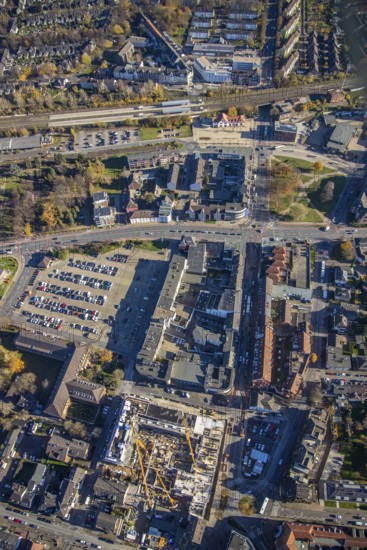 Aerial view, Mörs railway station, construction site new building Homberger Höfe, flats and commercial areas, formerly Horten, Augustastraße to Klever Straße, Mörs, Ruhr area, North Rhine-Westphalia, Germany, railway tracks, railway station, station forecourt, construction work, construction, construction area, construction site, building plots, construction crane, construction measure, construction project, construction site, DE, Deutsche Bahn AG, Europe, Friedrich-Ebert-Platz, commercial buildings, property tax, Hbf, Homberger Straße, real estate, Knappschaft Krankenversicherungsagentur, aerial view, aerial photography, aerial photography, new construction, car parks, overview, bird's eye view, residential complex, living and living, residential area, residential buildings, birds-eyes view, overview