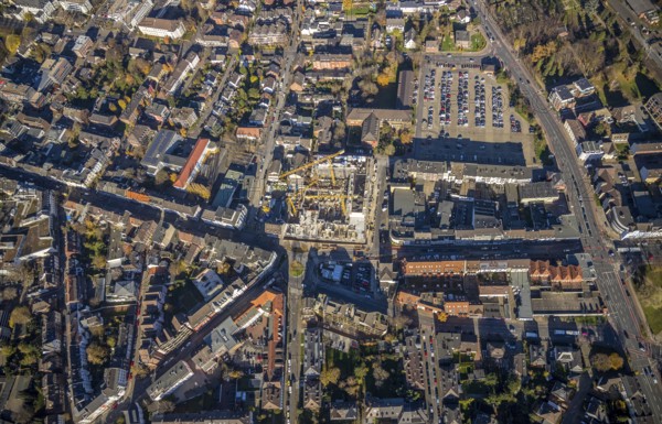 Aerial view, construction site new building Homberger Höfe, flats and commercial areas, formerly Horten, Augustastraße to Klever Straße, Mörs, Ruhr area, North Rhine-Westphalia, Germany, construction work, construction, construction area, building site, building plots, construction crane, construction measure, construction project, construction site, DE, Europe, Friedrich-Ebert-Platz, commercial buildings, property tax, Homberger Straße, real estate, Knappschaft health insurance agency, aerial view, aerial photography, aerial photography, new building, car parks, overview, bird's-eye view, residential complex, living and life, residential area, residential buildings, birds-eyes view, overview
