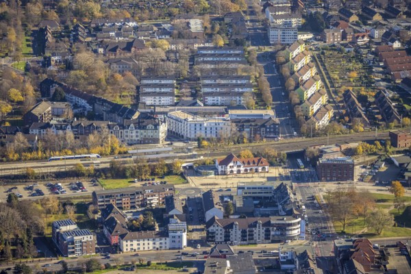 Aerial view, Mörs railway station, Homberger Straße to Klever Straße, Mörs residential and care centre, Homberger Straße housing estate, Tannenbergstraße, Mörs, Ruhr area, North Rhine-Westphalia, Germany, railway tracks, railway station, station forecourt, DE, Deutsche Bahn AG, Europe, property tax, central station, main station, Homberger Straße, real estate, Klever Straße, aerial view, aerial photography, aerial photography, apartment buildings, care service, terraced houses, overview, Vinzenzstraße, bird's-eye view, housing estate, housing and living, residential area, residential buildings, birds-eyes view, overview